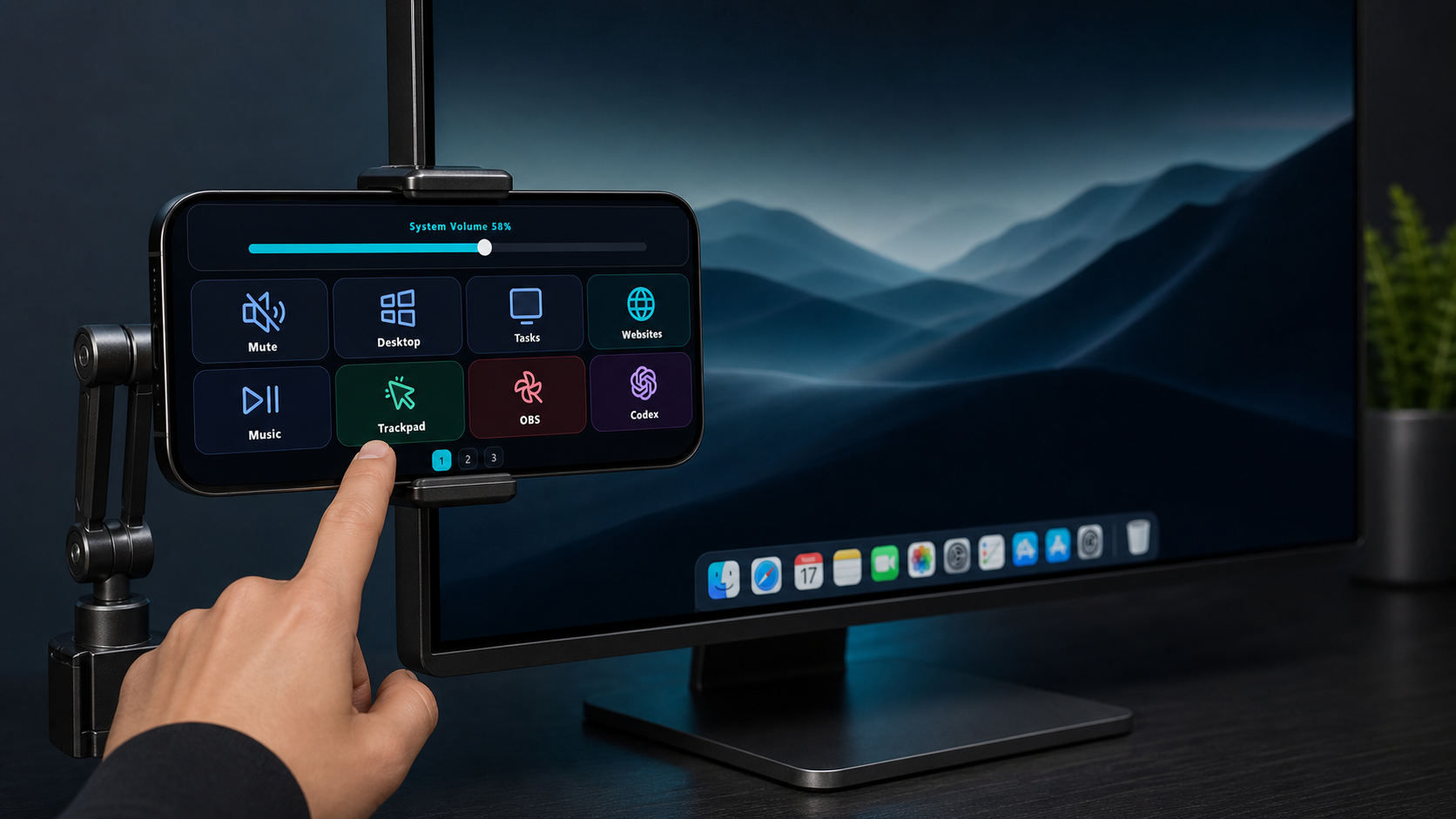 A mounted phone showing the AuxDeck control screen in English beside a computer monitor